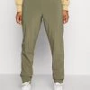 Columbia Mujer PLEASANT CREEK WARM JOGGER - Pantalones Montañeros Largos - Stone Green